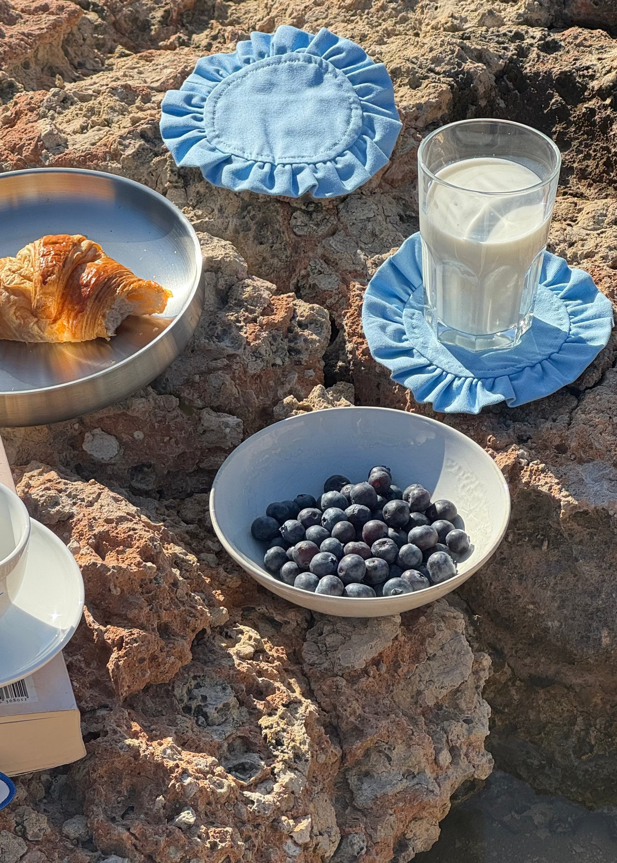 A table set outdoors with SOOS Atelier pieces